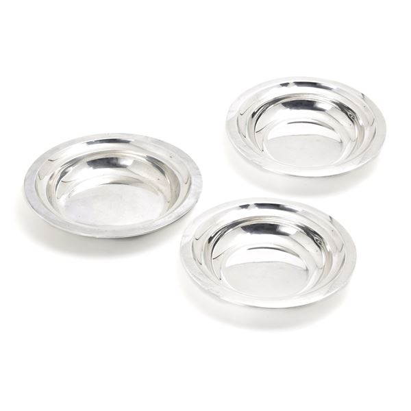 Three silver serving dishes