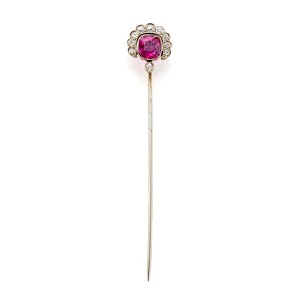 Gold pin with ruby
