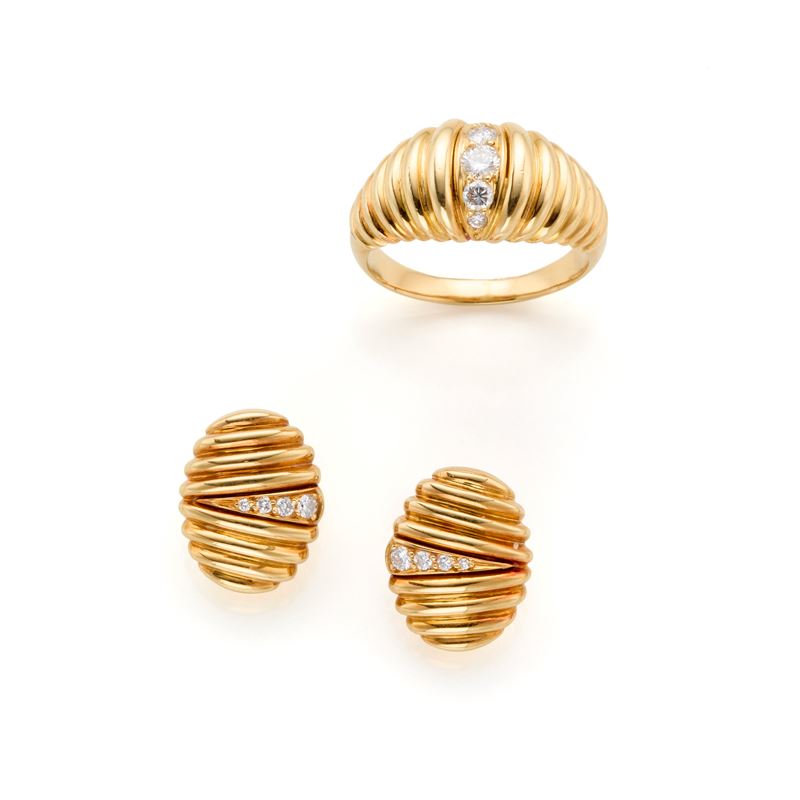 Demi parure in oro giallo 18 Kt con diamanti, composto da anello e orecchini