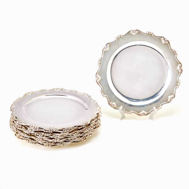 Dodici piattini in argento