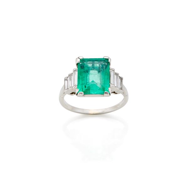 Platinum ring with emerald and diamonds