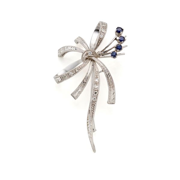 Gold brooch with diamonds and sapphires