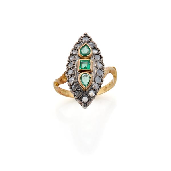 Gold and silver ring with emeralds and diamonds