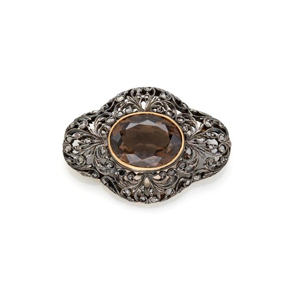 Silver brooch with topaz