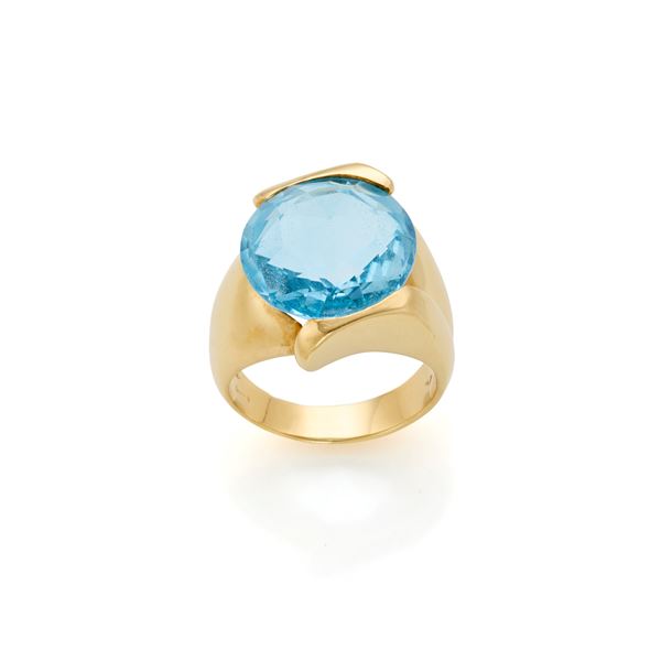 Gold ring with topaz