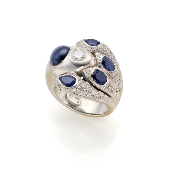 White gold ring with diamonds and sapphires