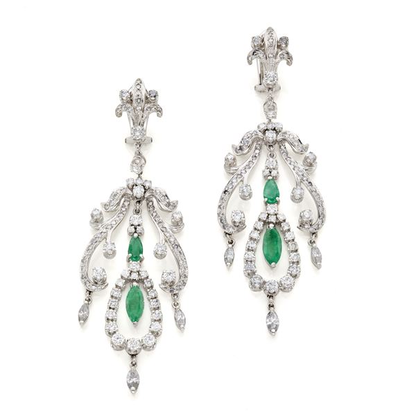 Gold drop earrings with diamonds and emeralds