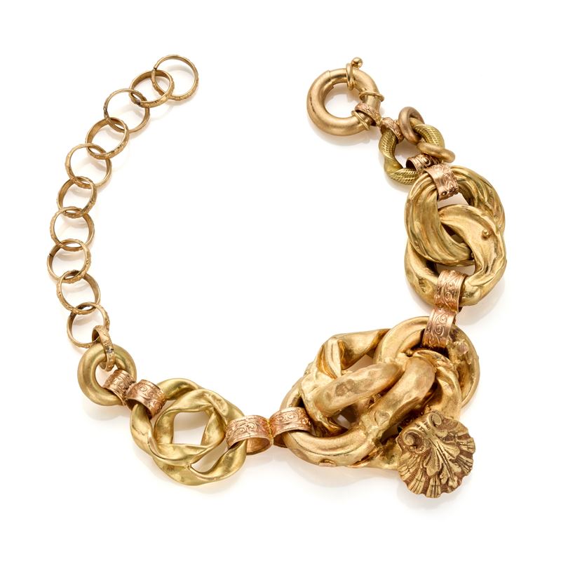 Bracciale in oro giallo e rosa 18 Kt con motivo a nodi e decorazione a conchiglia