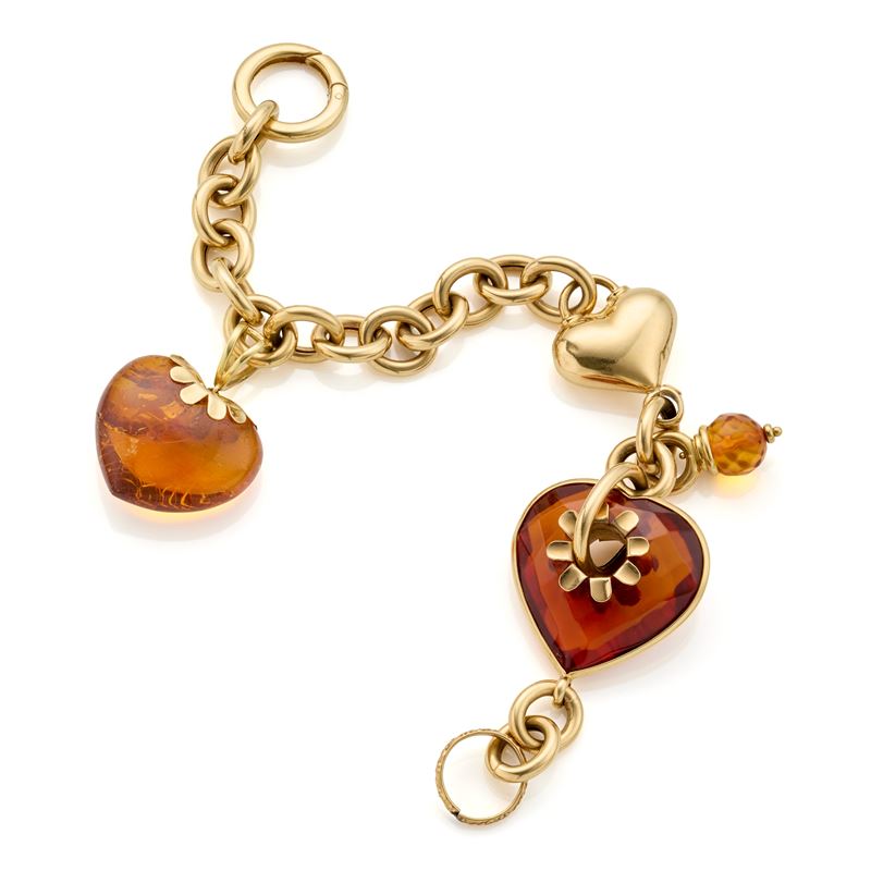 Bracciale in oro giallo 18 Kt con charms in ambra a cuore