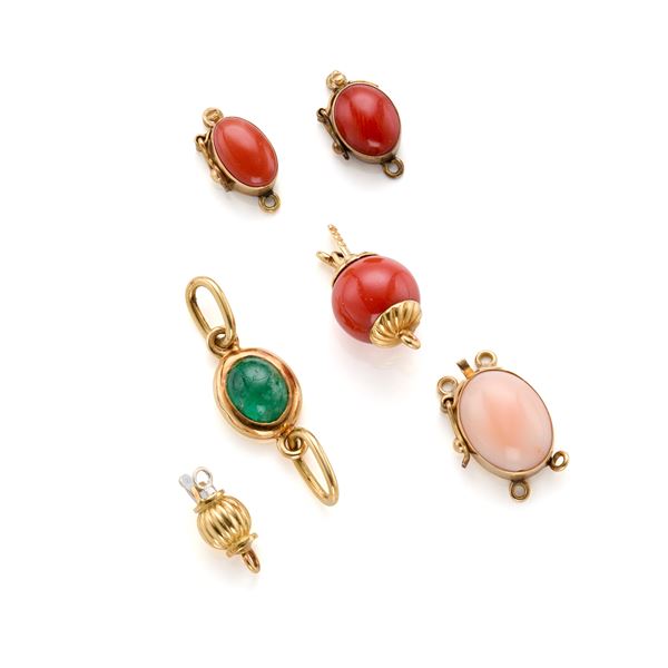 Six gold clasps with gemstones