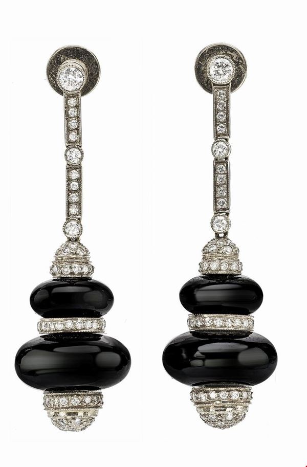 Gold earrings with diamonds and onyx
