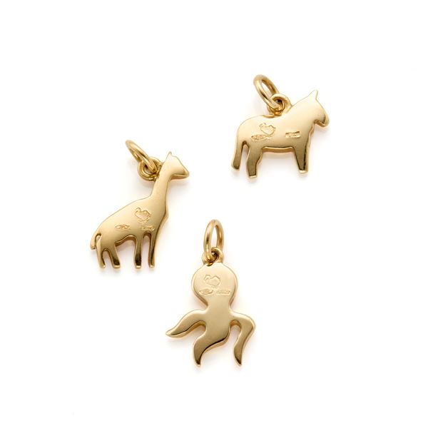 Three Dodo gold pendants
