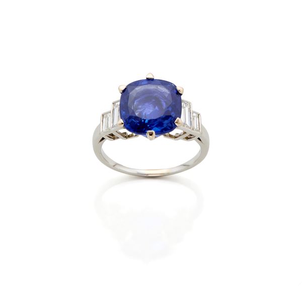 Platinum ring with sapphire and diamonds