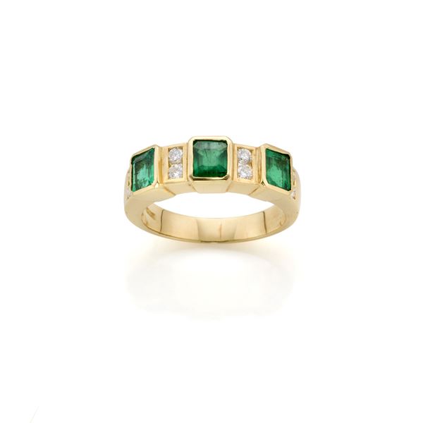 Gold ring with emeralds and diamonds