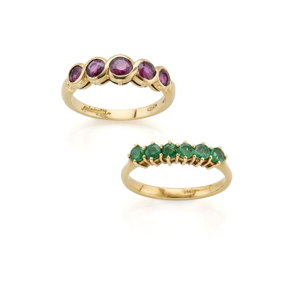 Set of two gold rings with rubies and emelards