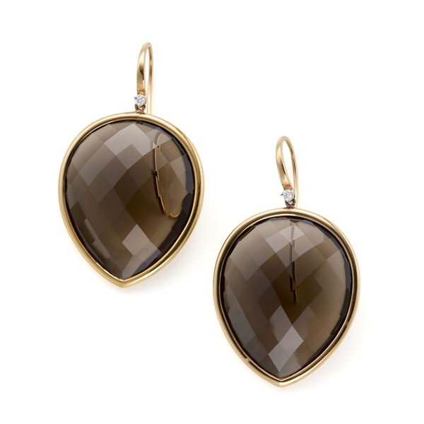 Gold earrings and quartz