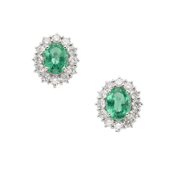 Gold earrings with diamonds and emeralds