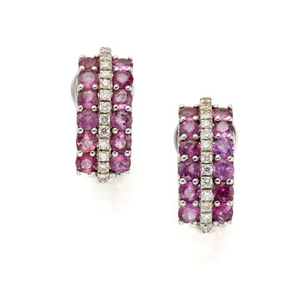 Gold earring with diamonds and pink gemstones