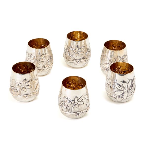 Six silver glasses