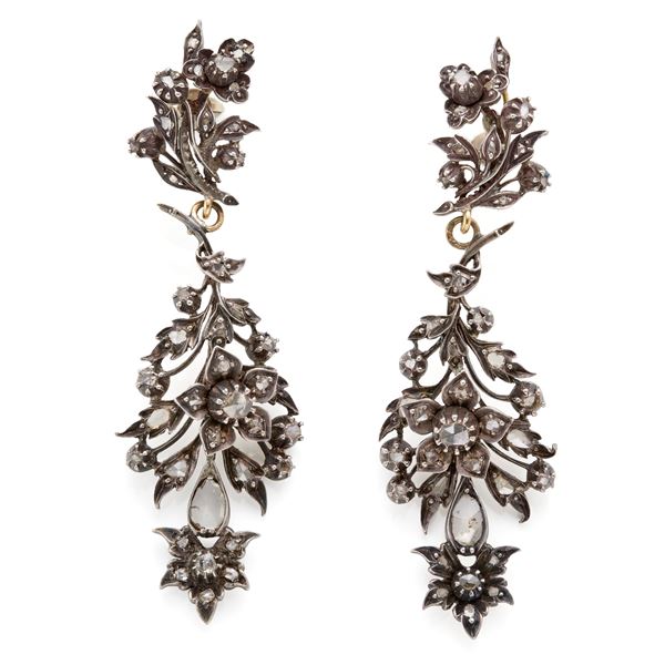 Silver and gold pendant earrings with diamonds