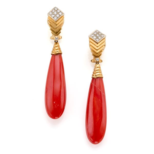 Gold pendant earrings with coral and diamonds.