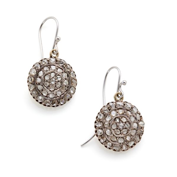 Gold and silver earrings with diamonds