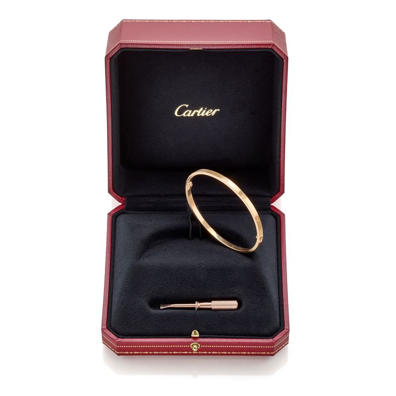Cartier, Bracciale Love modello piccolo in oro rosa 18 kt con accessori originali